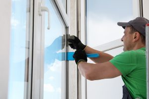 man installing soundproof windows