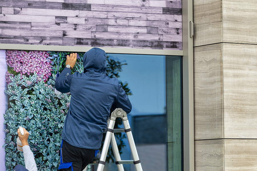 Workers Installing UV blocking windows